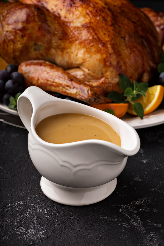 homemade-gravy-in-a-sauce-dish-with-turkey-2023-11-27-04-50-39-utc (1)